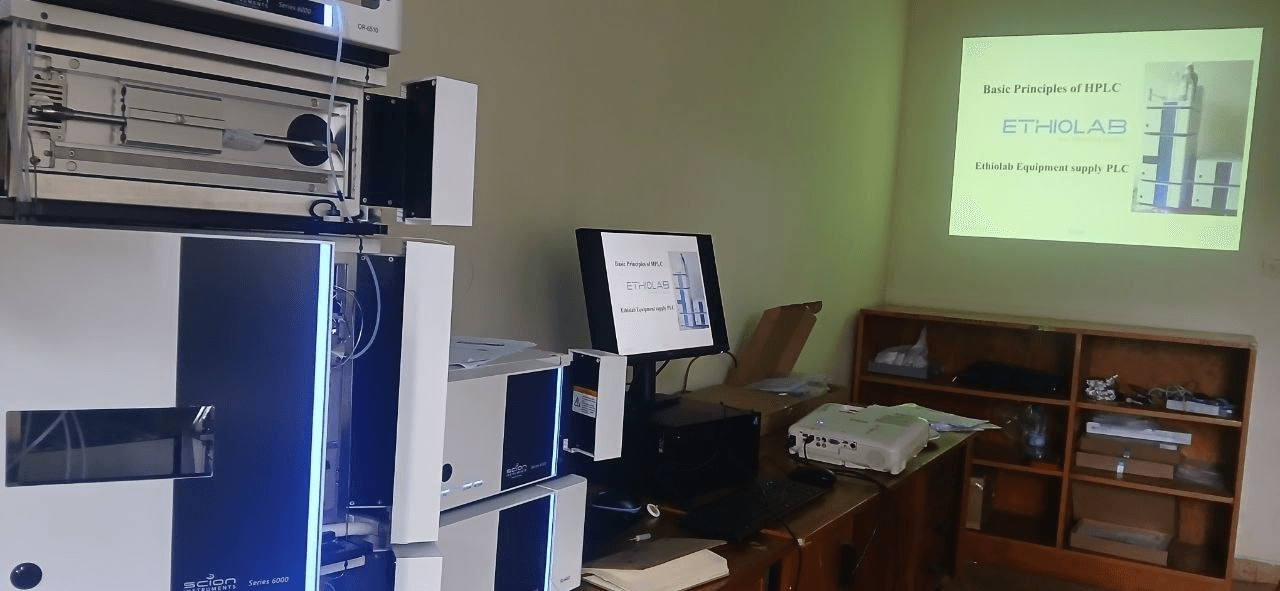 HPLC theory presentation projected beside the installed instrument