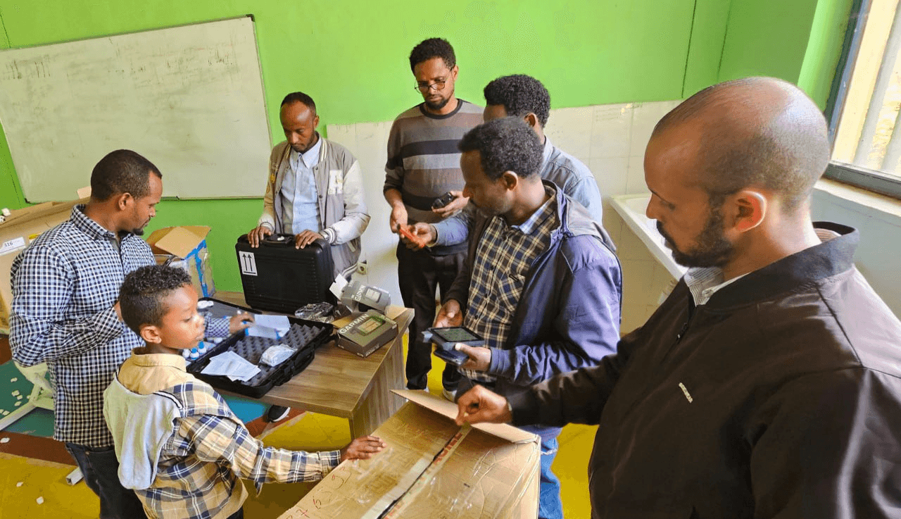 Ethiolab staff demonstrating water testing kits to Haramaya University staff