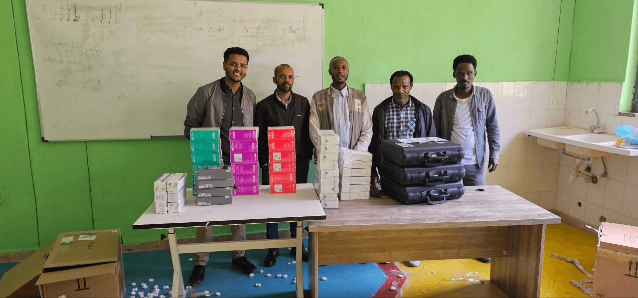 Haramaya University team with the delivered water kits and laboratory equipment